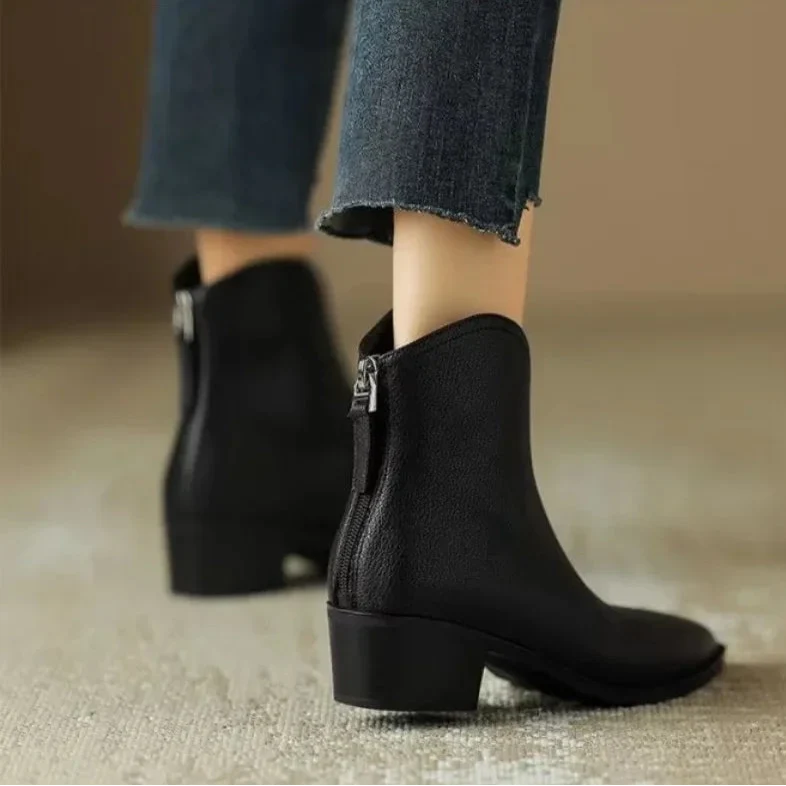 Chic women's slip-on ankle boots with a sophisticated pointed toe and comfortable low heel.