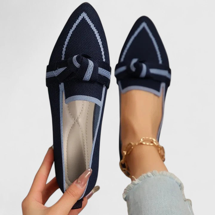Elegant women's pointed toe slip-on flats. Stylish loafers with a sleek design and contrast trim.