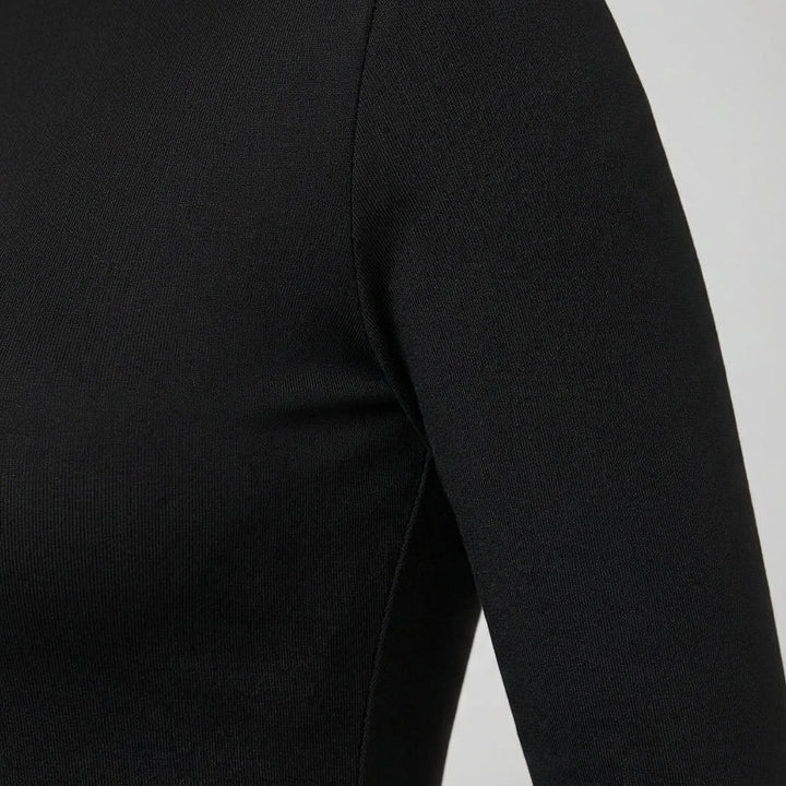 Women's insulating long sleeve thermal top in a slim fit, ideal for winter outdoor activities or sportswear.