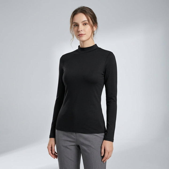 Breathable slim fit women's thermal shirt, designed as a long sleeve baselayer for active winter wear.