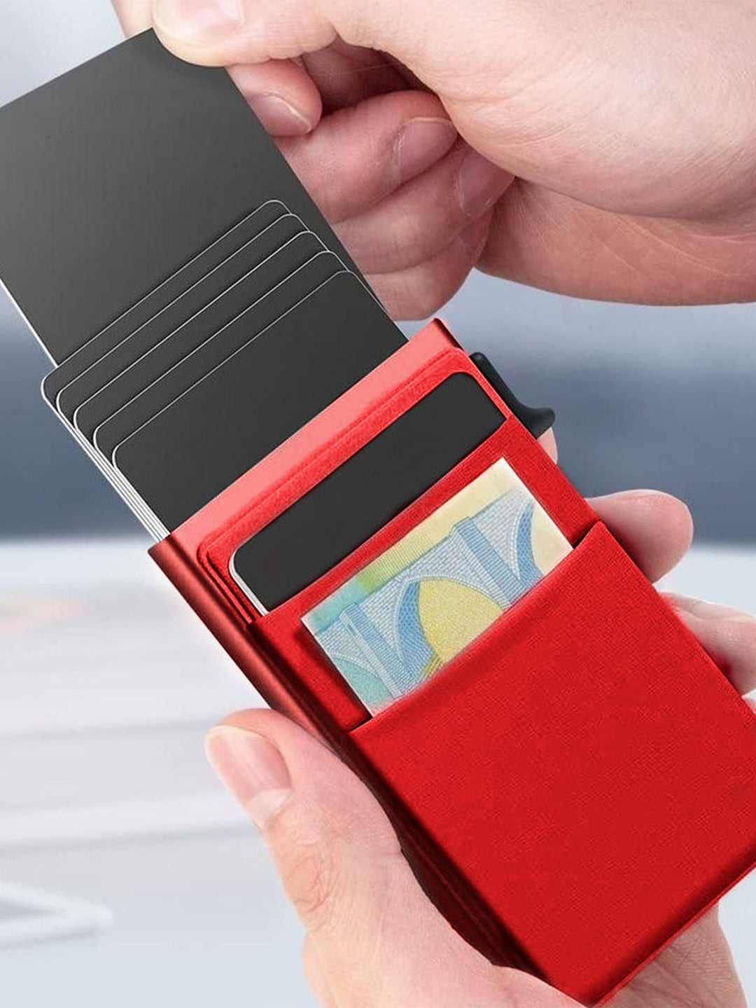 Men's thin metal wallet, RFID protected, holding multiple credit cards securely