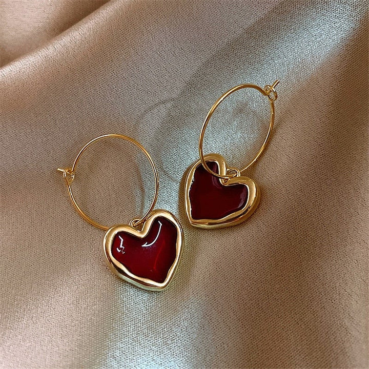 Small red heart earrings, women's delicate plated silver jewelry, romantic fashion accessory.