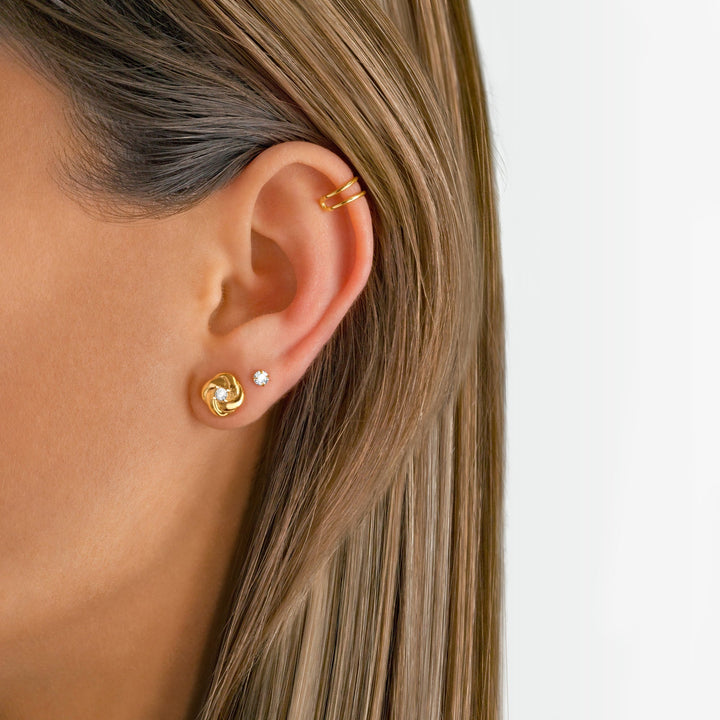 Women's sparkling sterling silver stud earrings with clear zirconia.
