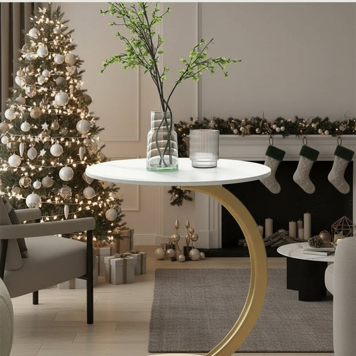 SMALLIX round side table next to a sofa, perfect modern living room accent for compact spaces.