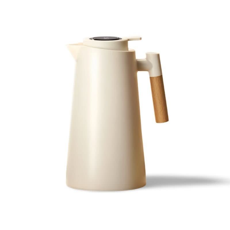 Insulated thermos carafe with digital temperature display. Stainless steel, keeps drinks hot/cold.