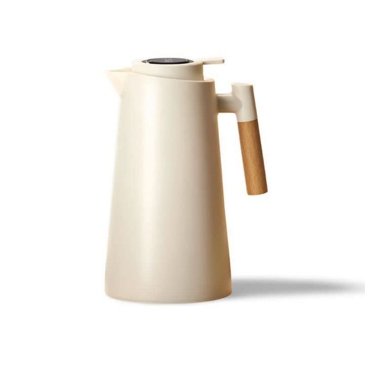 Insulated thermos carafe with digital temperature display. Stainless steel, keeps drinks hot/cold.