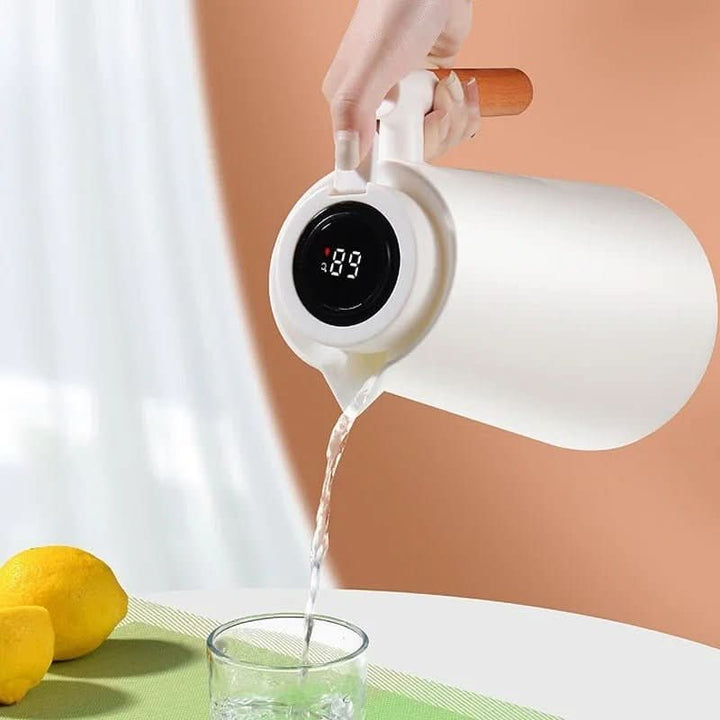 Essential kitchenware: insulated thermos carafe with digital temp display & wooden handle.