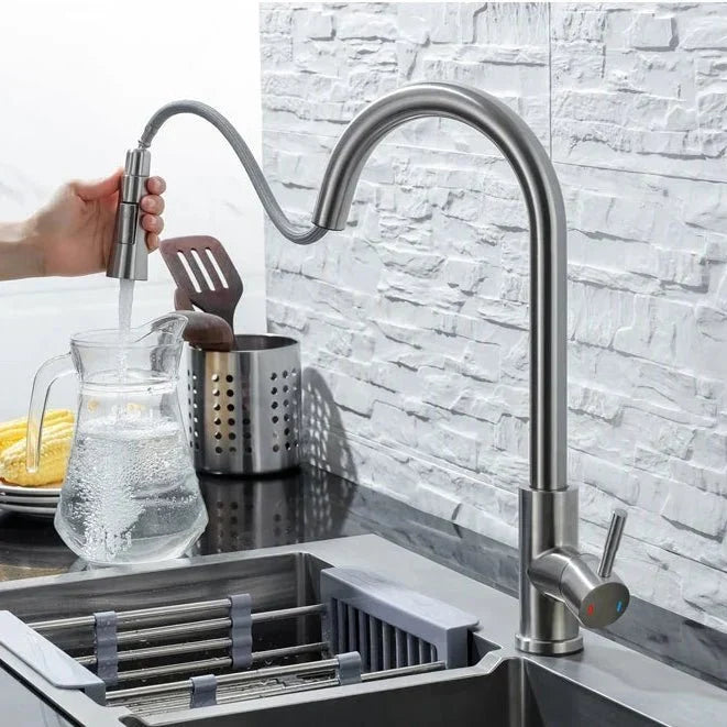 Touchless kitchen faucet with motion sensor and versatile pull-down sprayer in sleek stainless steel.