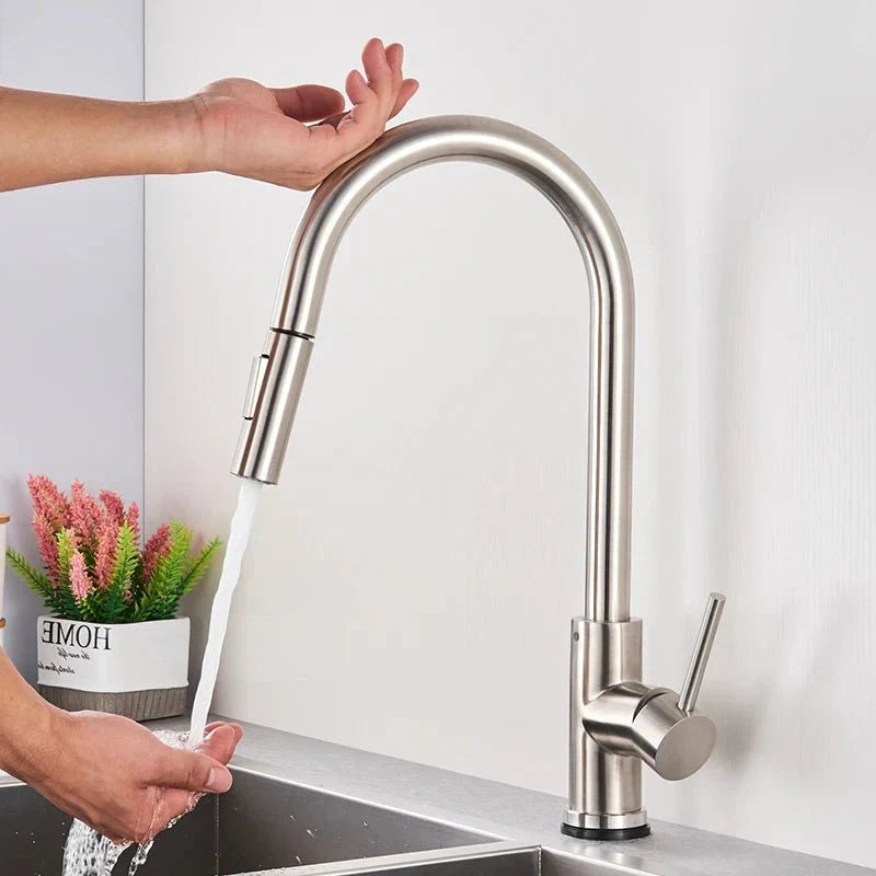 Modern black smart sensor kitchen faucet, featuring a handy pull-out sprayer for easy dishwashing.