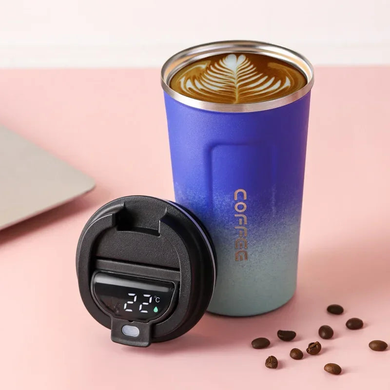 Modern stainless steel travel mug with smart digital display, keeps drinks at desired temperature.