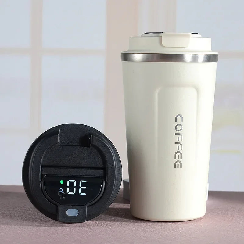 Portable stainless steel insulated bottle for hot or cold beverages, showing temperature digitally.
