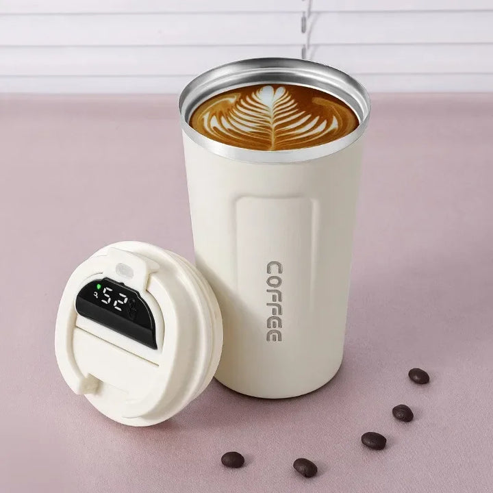 Reusable stainless steel travel mug with digital temp display, ensuring perfect hot or cold drinks.