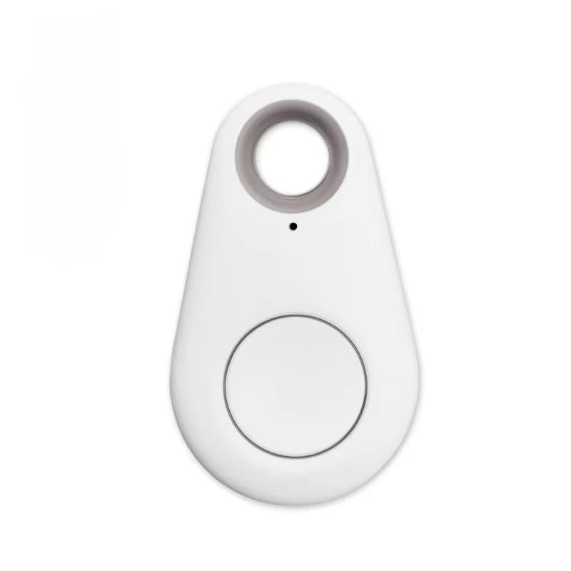 SMARTPET GPS item finder next to everyday essentials, emphasizing its compact and versatile use.