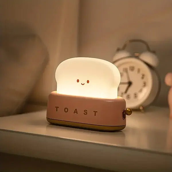 Cute GlowToasty smiling toast night light, a soft LED lamp perfect for kids' rooms & nursery.