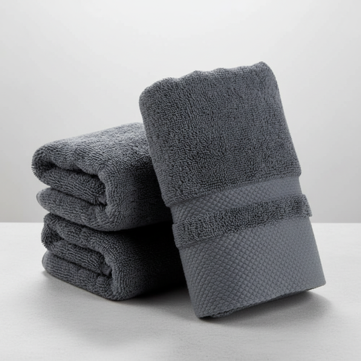 Plush white cotton blend bath towel, offering ultimate softness and high absorbency for your bathroom
