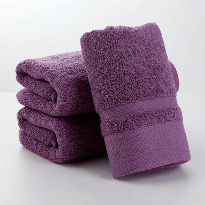 Stack of colorful cotton blend bath towels, soft and absorbent, featuring a striped design