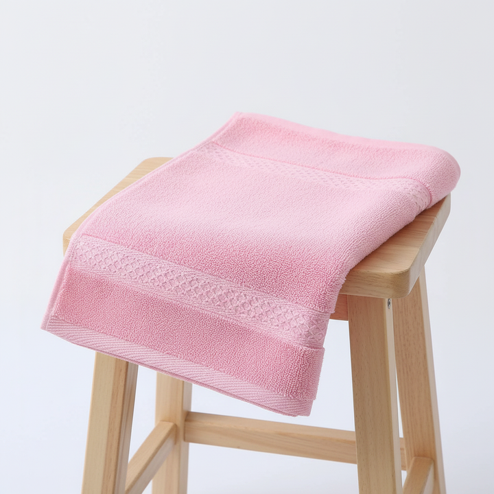 Close-up of a plush, soft cotton bath towel from the 'CottonJoy' 4-piece set, highlighting texture.