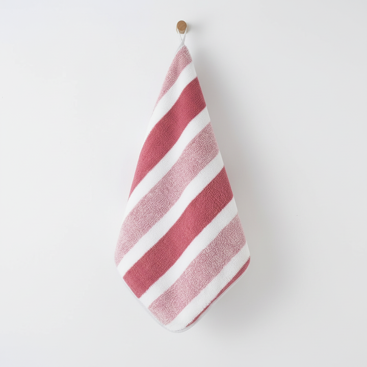 Unisex coral fleece hand towels with soft stripes. Highly absorbent, perfect for any bathroom decor.