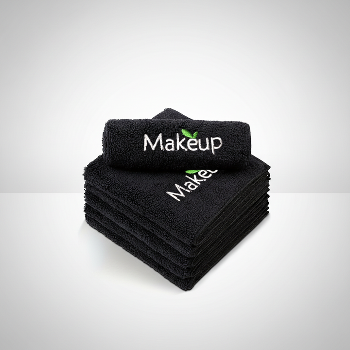 Stack of black microfiber towels, ideal for facial cleansing, makeup removal, and skincare routines.