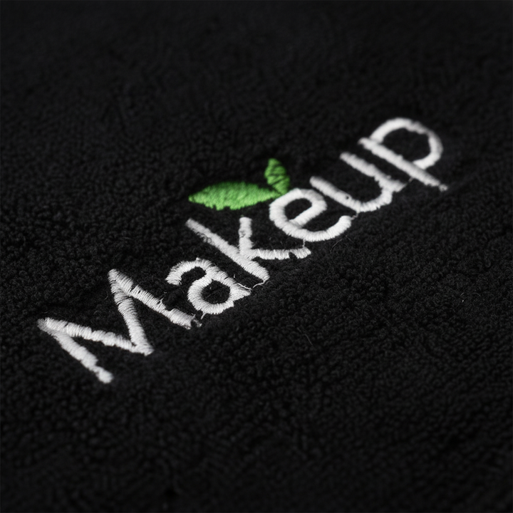 Close-up of plush microfiber face cleansing towel in black, highlighting its soft texture for skin.