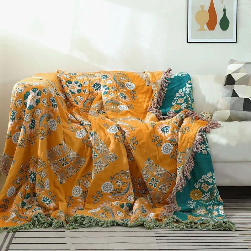 Bohemian cotton throw blanket in vibrant orange and yellow hues, ideal for cozy home accents.
