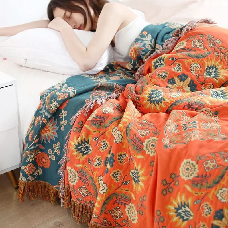 Cozy orange & yellow cotton throw, soft boho blanket for stylish bedroom and living room decor.