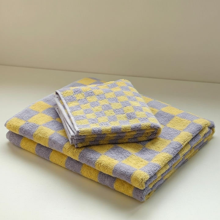 Quick dry cotton bath sheet in a chic checkerboard design, ideal for a contemporary bathroom.