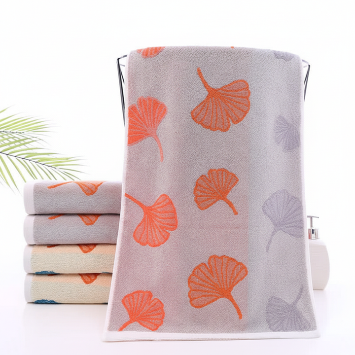 Plush white cotton ginkgo towel, highly absorbent, perfect blend of comfort and style