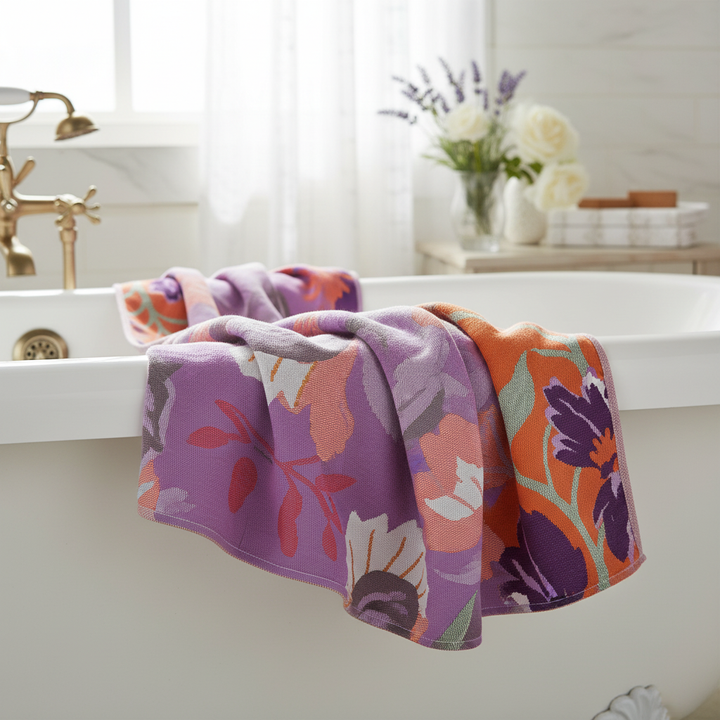 Soft cotton bath towel with elegant lavender floral pattern, high absorbency, perfect for modern bathrooms.