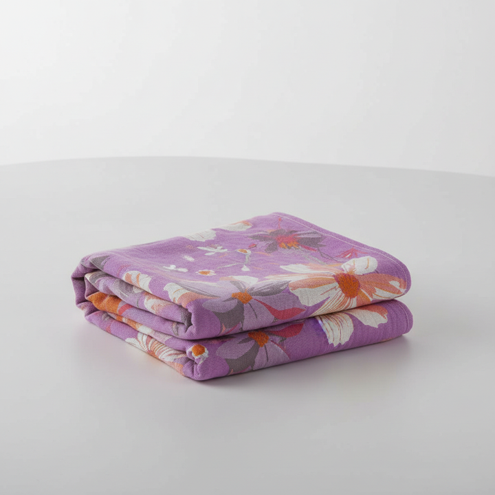 Luxurious lavender floral cotton bath towel, soft and absorbent, enhances bathroom decor, home textiles.