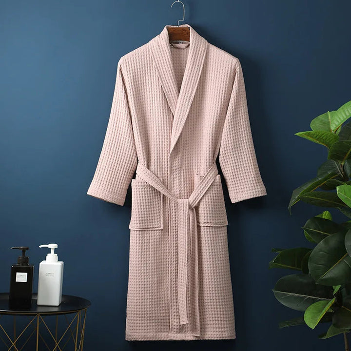 Plush, absorbent cotton unisex bathrobe, perfect for post-bath relaxation or spa.
