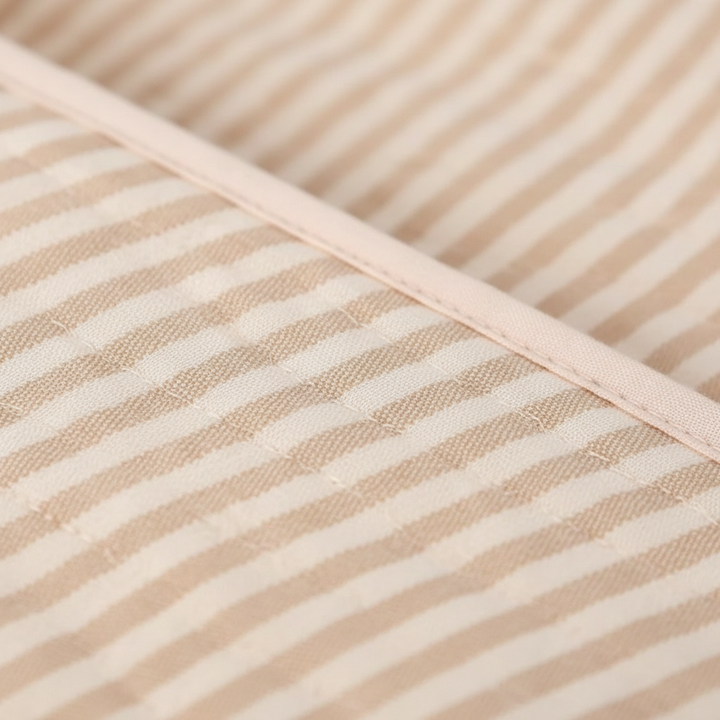 Peaceful baby wrapped in a DreamWrap calming swaddle blanket, offering sleep solutions for newborns