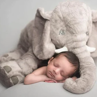 Cute grey baby elephant plush toy cuddle pillow for babies. A soft, comforting infant pillow & great newborn gift.