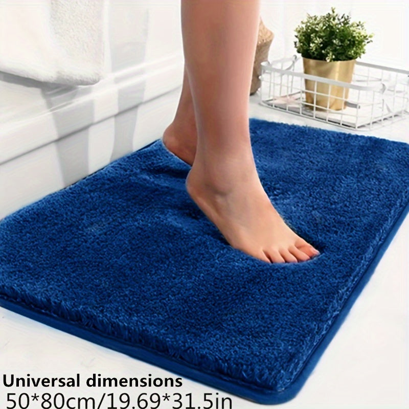 Geometric patterned bath mat, soft, non-slip, and absorbent for ultimate bathroom comfort.