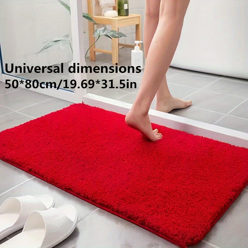 Absorbent non-slip bath mat, soft polyester, geometric pattern, enhances bathroom comfort.