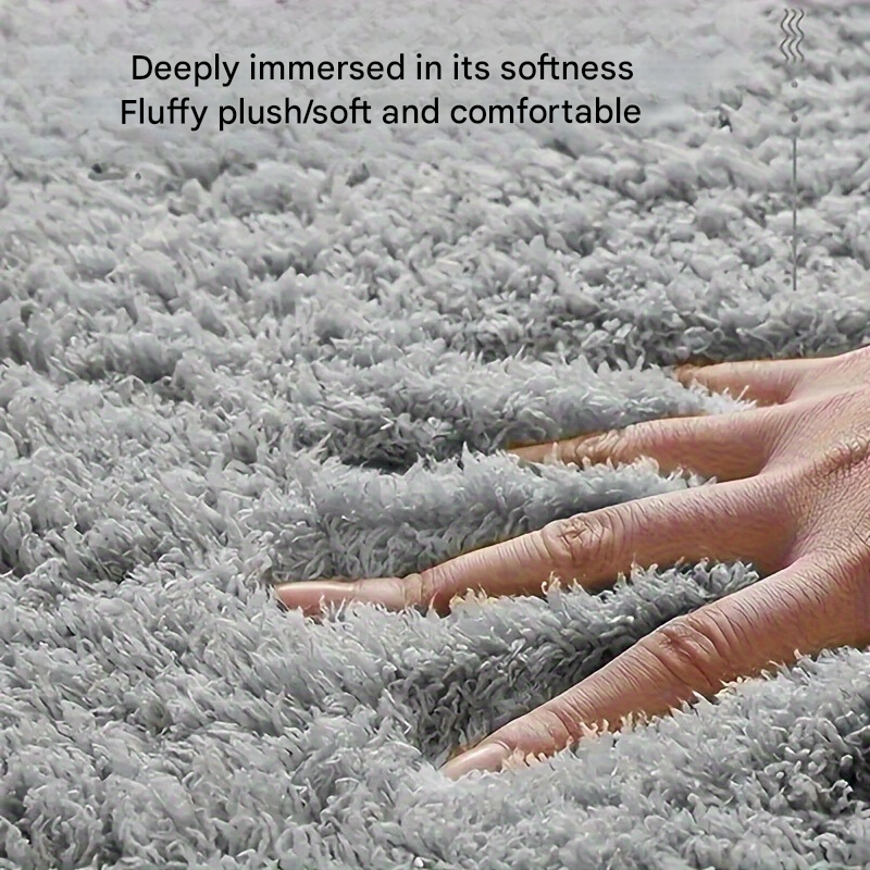 Soft non-slip bath mat, geometric design, absorbent, ideal for modern bathroom decor.
