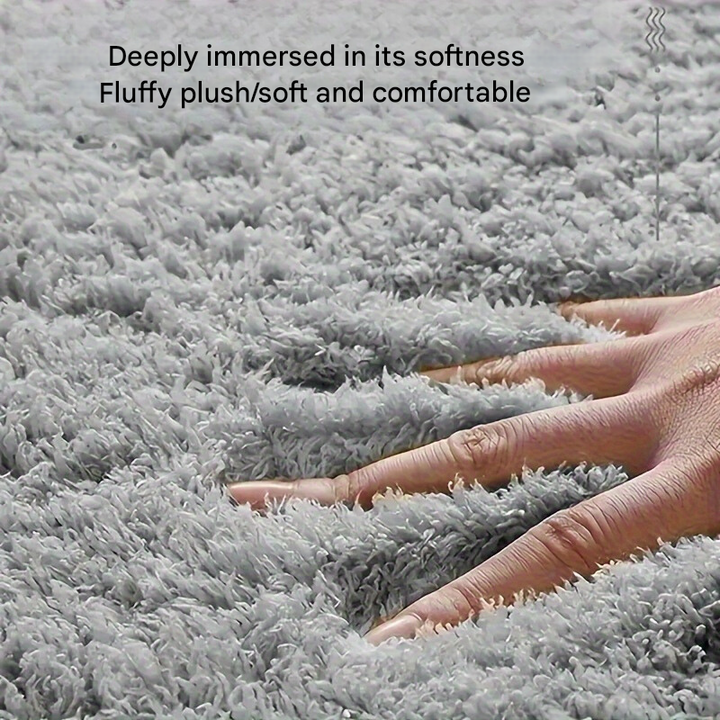 Soft non-slip bath mat, geometric design, absorbent, ideal for modern bathroom decor.