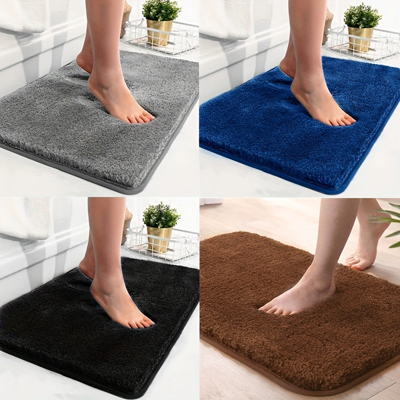 Luxury absorbent bath mat, soft polyester, non-slip backing, enhances bathroom comfort.