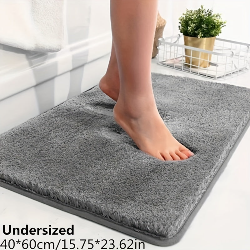 Absorbent polyester bath mat, non-slip luxury for your home bathroom decor.