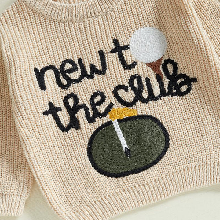 Plush beige baby knit pullover sweater, providing ultimate comfort for little ones.