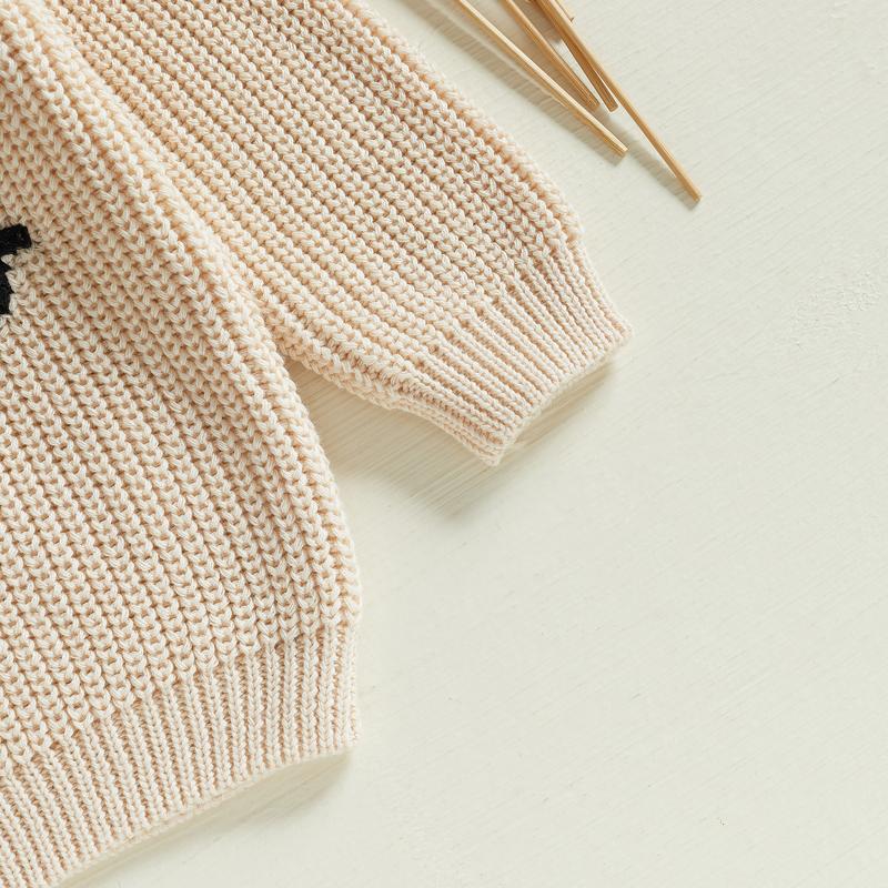 Adorable knit baby pullover, soft and embroidered, perfect for stylish infant comfort.