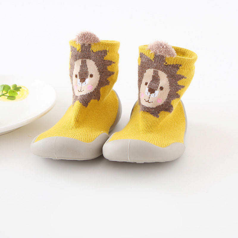 Close-up of anti-slip sole on white knitted toddler slippers, infant safety footwear