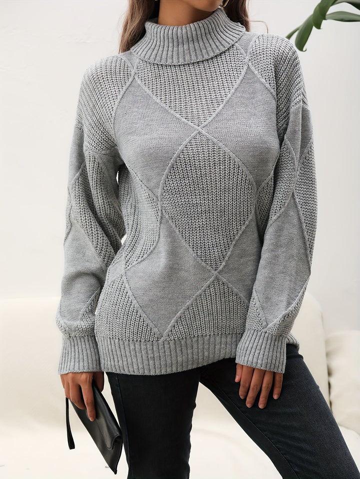 Comfortable women's gray knitted turtleneck sweater featuring a dropped shoulder, essential winter fashion.