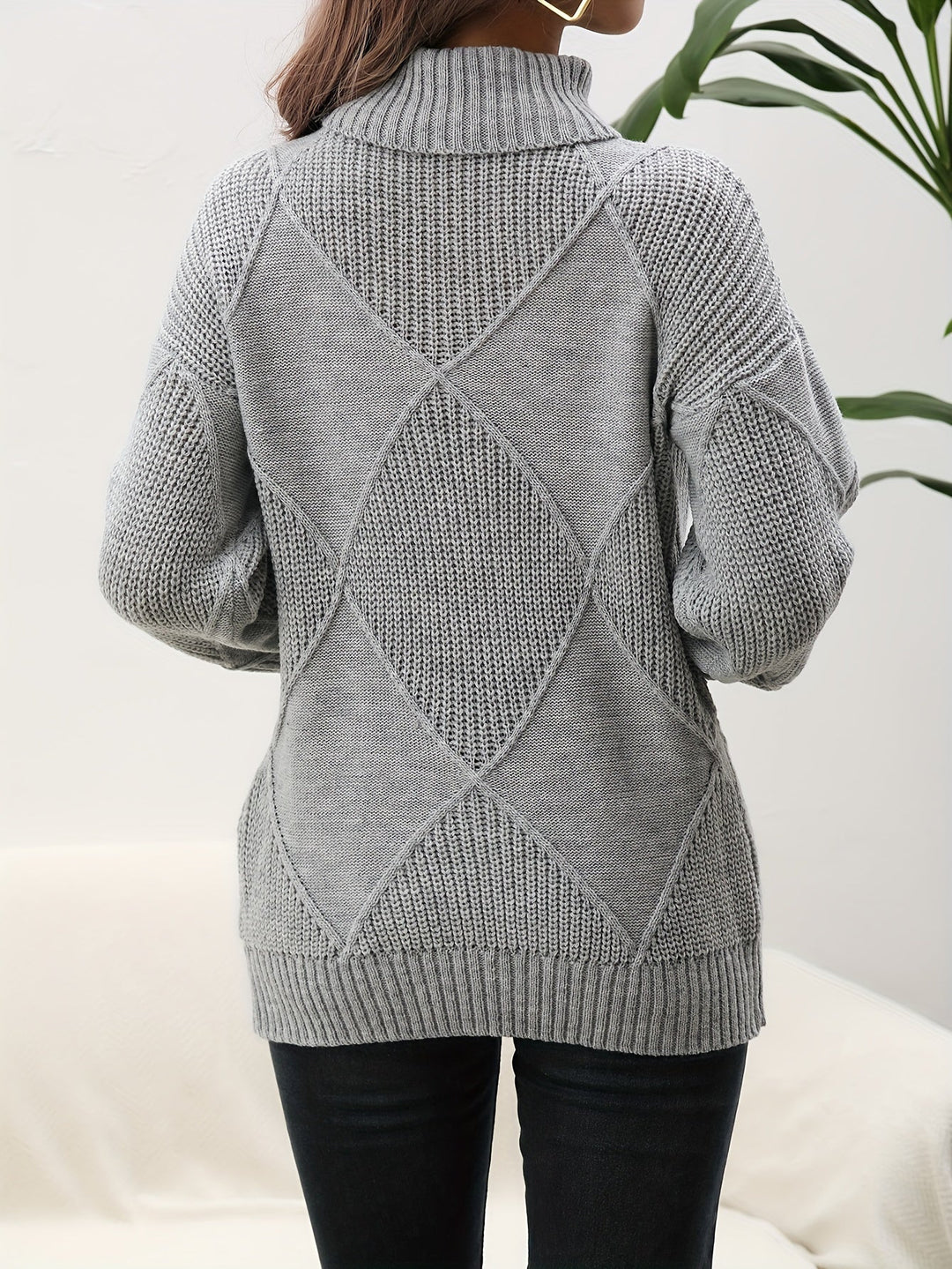 Comfortable yellow women's knitted turtleneck sweater with dropped shoulder, a cozy choice for winter fashion.