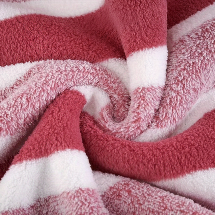 Cozy gray microfiber throw blanket casually folded, highlighting its soft and comfortable feel