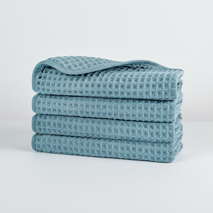 Waffle weave microfiber washcloth drying on a hook, showcasing its quick-dry advantage