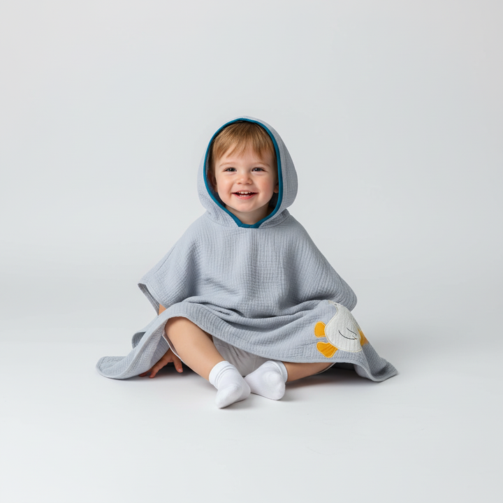 Quick dry baby bath poncho made from gentle muslin, great for active little ones