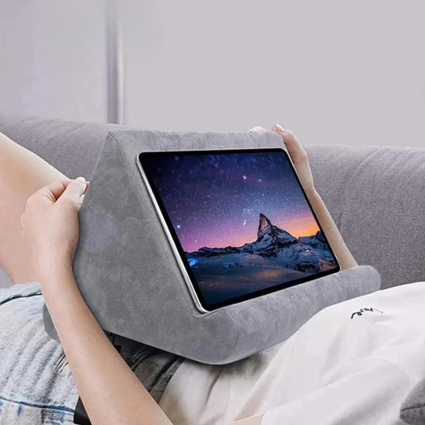 Soft pillow tablet & phone stand, universal hands-free device support for comfortable viewing.