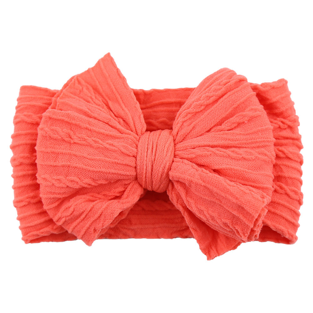 Purple soft nylon bow headband, a charming infant accessory for baby girls.