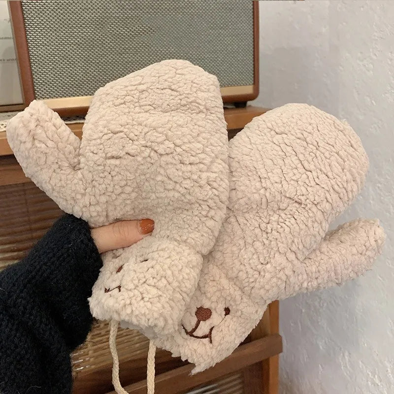Cozy women's teddy mittens, a stylish winter accessory for warmth and fashion.